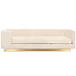 Goldfinger Sofa with Brushed Brass Toe Kick : Introducing the Goldfinger Sofa in Velvet. This artistic sofa is defined by its asymmetrical design and sleek appearance. One arm is beautifully curved in contrast to the other arm, and the Goldfinger Sofa fea