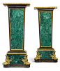 A pair of Louis XIV style ormolu-mounted malachite and ebonized pedestals probably Russian, second half 19th century height 50 1/4 in.; width 22 in.; depth 14 in. 128 cm; 56 cm; 36 cm: 