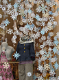 paper snowflakes in Anthropologie holiday window display. #paper #retail #merchandising #display #snowflakes #Christmas