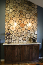 Create a similar wall panel of logs using log tiles from www.thelogbasket.co.uk.