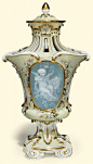 A MEISSEN PALE YELLOW GROUND PATE-SUR-PATE POT-POURRI VASE AND COVER <br />LATE 19TH CENTURY, BLUE CROSSED SWORDS MARK AND <i>PRESSNUMMER</i> 4/R62 <br />The front and back with a pale-blue oval panel decorated in white slip with a