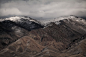 A snowy mountain with a shrub-covered slope in Nevada