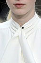 White Shirt collar detail - neck tie, tucks around the collar & minimal pin feature; chic fashion design details