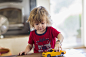 Caucasian boy playing with toy car by Gable Denims on 500px