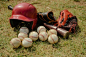 Free Red Baseball Helmet on Green Grass Field Stock Photo