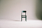 Green Wooden Chair on White Surface