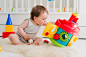 baby playing with educational toys lying by Yuliya  Shangarey Shangarey on 500px