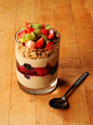 Berry and soy yogurt parfait - plain soy yogurt layered with thawed mixed berries topped with hemp granola, strawberries, and kiwi.
