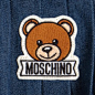 Baby Girls Blue Denim Pleated Teddy Skirt : Baby girls sweet blue skirt by Moschino Baby, made in soft cotton denim. A fully pleated skirt with an elasticated waistband for easy dressing. On the front there is a cute teddy and logo appliqué. It would look