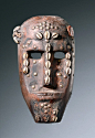 Africa | Mask "ntomo" from the Bamana people of Mali | Wood, residues of red paint, cowrie shells and metal tags