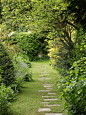 Photo of a large traditional partial sun backyard stone garden path in Hampshire.