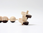 craft combine creates a spinning top influenced by korean characters : design firm craft combine has created a set of spinning tops influenced by hangeul characters, made out of two types of hardwood.