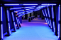 Matching the blue used in the Turner Media Plus graphics, Triton Productions fashioned a brightly illuminated entrance tunnel that led...: 