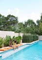 A modern pool/ The seating bench provides a great spot to relax, sip on a glass of wine and catch some rays!