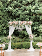 Wedding ceremony arch with draping fabric and chandelier. Succulents, roses, hydrangea, eucalyptus, dahlias. Blush, peach mint. -Florals by Jenny -Honey Honey Photography -Franciscan Gardens