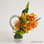 orange and green modern floral arrangment: 