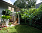 Photo of a small tropical partial sun backyard landscaping in Hawaii.