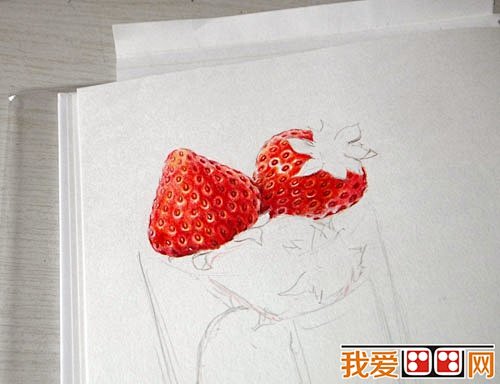 2、用同样的方法画好露出来的另一个草莓，...