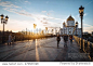 Famous christian landmark in Russia - Christ the Savior cathedral at sunset. Golden sunset lights on a bridge in Moscow, outdoor autumn in Russia. Christ the Savior cathedral, outdoor Moscow landscape