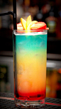 Paradise - Light rum, Malibu, blue curacao, pineapple juice and grenadine.