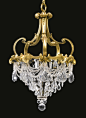 Edward F. Caldwell & Co A GILT BRONZE AND MOULDED CRYSTAL CHANDELIER New York, late 19th/early 20th century: 