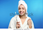 Portrait of young woman with electric toothbrush on color background