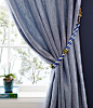 Create a curtain tieback with pattered rope from the hardware store! Learn how on our Style Blog: https://www.onekingslane.com/live-love-home/ropeprojects/: 