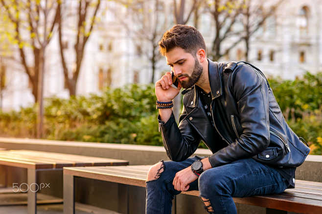 Young man sitting on...