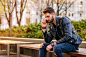 Young man sitting on a bench by Michael Osterrieder on 500px