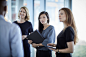 Attentive businesswomen listening to businessman by Caia Images on 500px