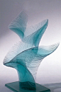 Artist Niyoko Ikuta Uses Layers of Laminated Sheet Glass to Create Spiraling Geometric Sculptures