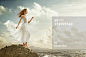 High-Res Stock Photography: Caucasian woman on rock overlooking ocean