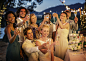 Wedding guests toasting with champagne during wedding reception in garden by Caia Images on 500px