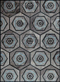Kyle Bunting geometric patterned hide rug with Geoffrey Bradfield.