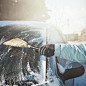 Transportation, winter, weather, people and vehicle concept - woman cleaning snow from her car with  by Andrea Obzerova on 500px