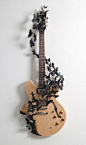 "Rise", 2011; Electric guitar, aluminum (found cans), wire, soot 44” x 15.5” x 9” Paul Villinski