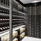 bespoke home wine cellar with wood and marble serving shelf  Wine Cellar  Grassl Wine Glassware  cjfselections.com