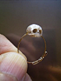 carved pearl skull ring: