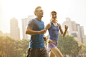 Couple running in urban park by Caia Images on 500px