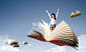 人,亚洲人,未成年学生,可爱的,微笑_gic11128774_a girl flying on a book_创意图片_Getty Images China