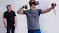 Mark Zuckerberg, Facebook CEO, in the Oculus Rift virtual-reality headset as Oculus VR CEO Brendan Iribe looks on.