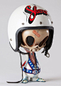 ARTIST: Jay Hollopeter TITLE: Skevel Knievel SIZE: 19” Tall (With Helmet) MEDIUM: Mixed Media with Vintage Helmet