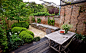 Espaliered fruit trees in Antwerp walled garden ; Gardenista