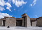 Jianamani Visitor Centre by Atelier TeamMinus : Atelier TeamMinus has completed a visitor centre for an ancient Buddhist memorial in Tibet, with stone walls, a central courtyard and 11 observation decks.