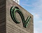 The CV channel letter logo was fabricated from aluminum and cast into the board formed concrete. The logo is illuminated using glass rock and resin.