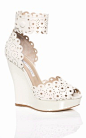 An eyelet white wedge by Oscar de la Renta - the ultimate in comfort and style! #wedding #shoes
