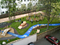 Pocket Park / In addition to the climbing structure, the blue "stream" provides drainage, preventing rainwater from pooling up in the playground.