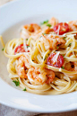 Shrimp Scampi linguine on a plate garnished with parsley and parmesan made from easy shrimp scampi pasta recipe