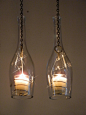 Wine Bottle Hanging Lanterns. I love this so much I want to buy a house just so I can use this idea. lol