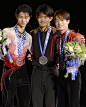 KENT United States Japan's Takahiko Kozuka Yuzuru Hanyu and Tatsuki Machida wear their gold silver and bronze medals at Skate America in Kent...